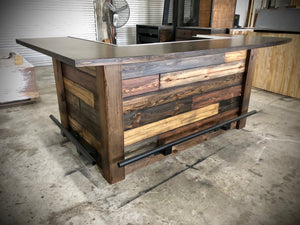 Rustic reclaimed plank goodtimes bar with foot and drink rail